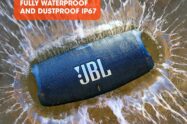 a JBL speaker in water with text above it